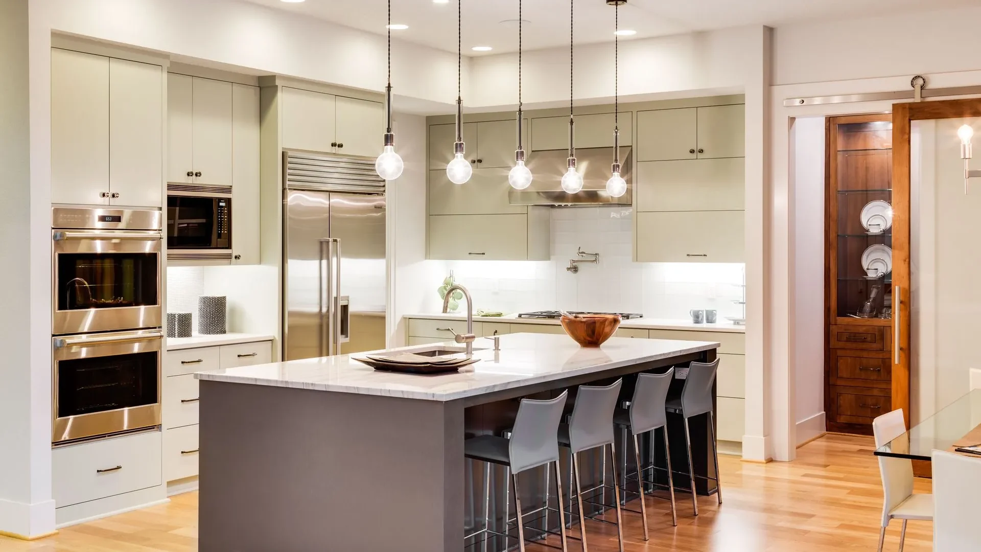 Kitchen with stailess steel appliances and center island