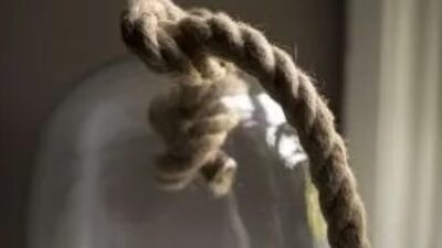 Glass cub with rope attached