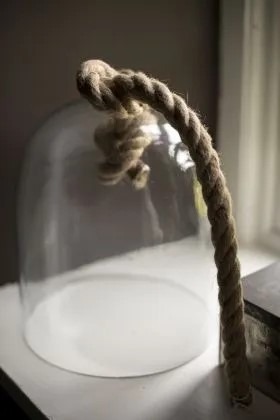 Glass cub with rope attached