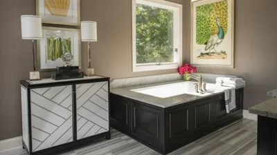 Bathroom renovation after image showing vanity and large jacuzzi bathtub
