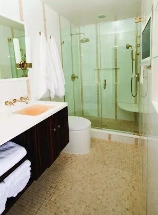 Bathroom with Kohler Purist sconces in French gold